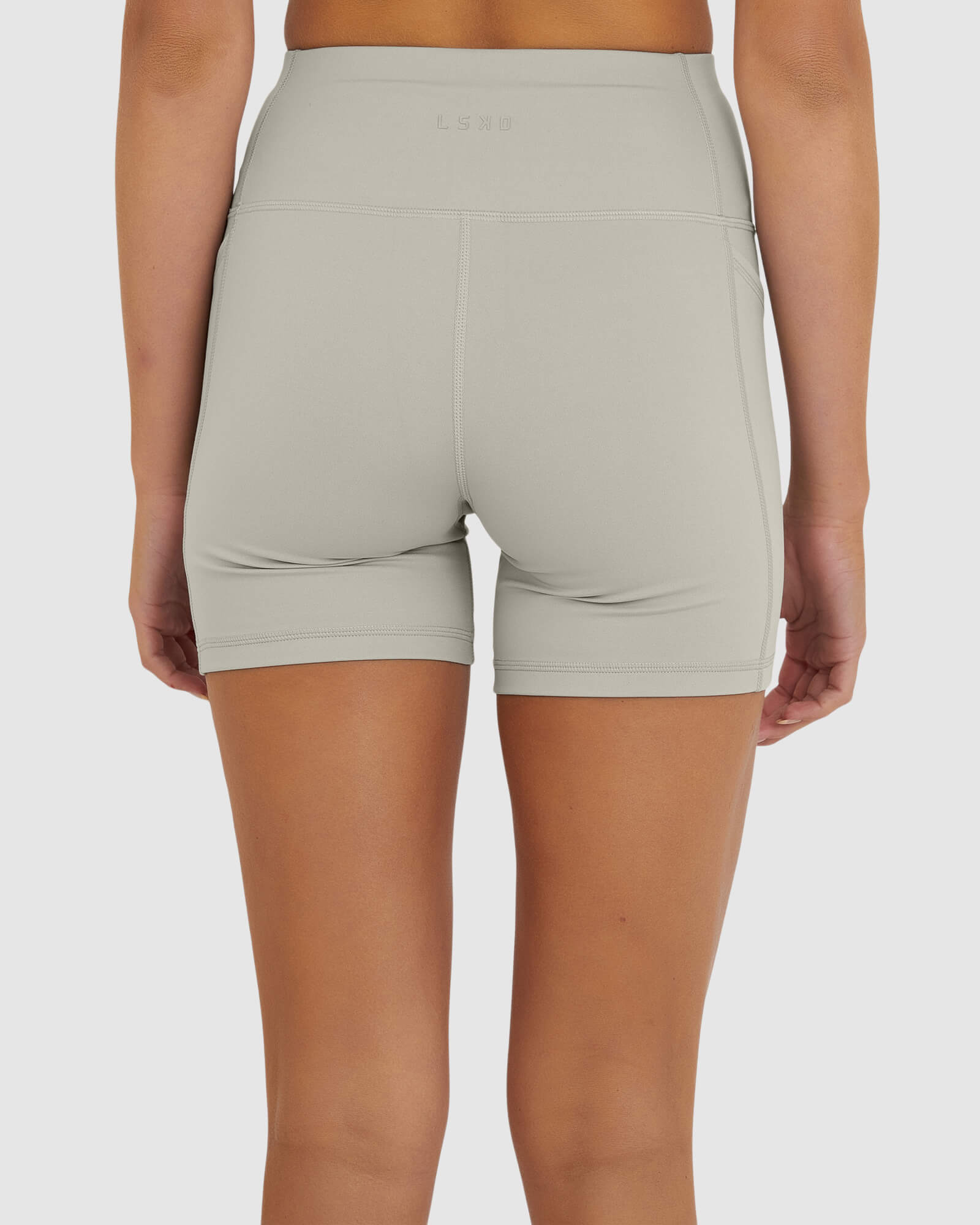 Model wearing Rep X-Short Tight Small Logo - Pussywillow