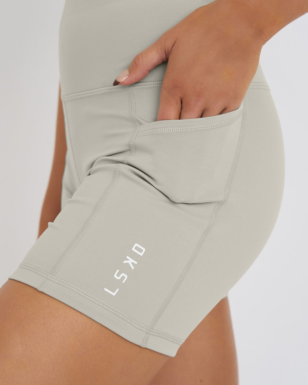 Model wearing Rep X-Short Tight Small Logo - Pussywillow