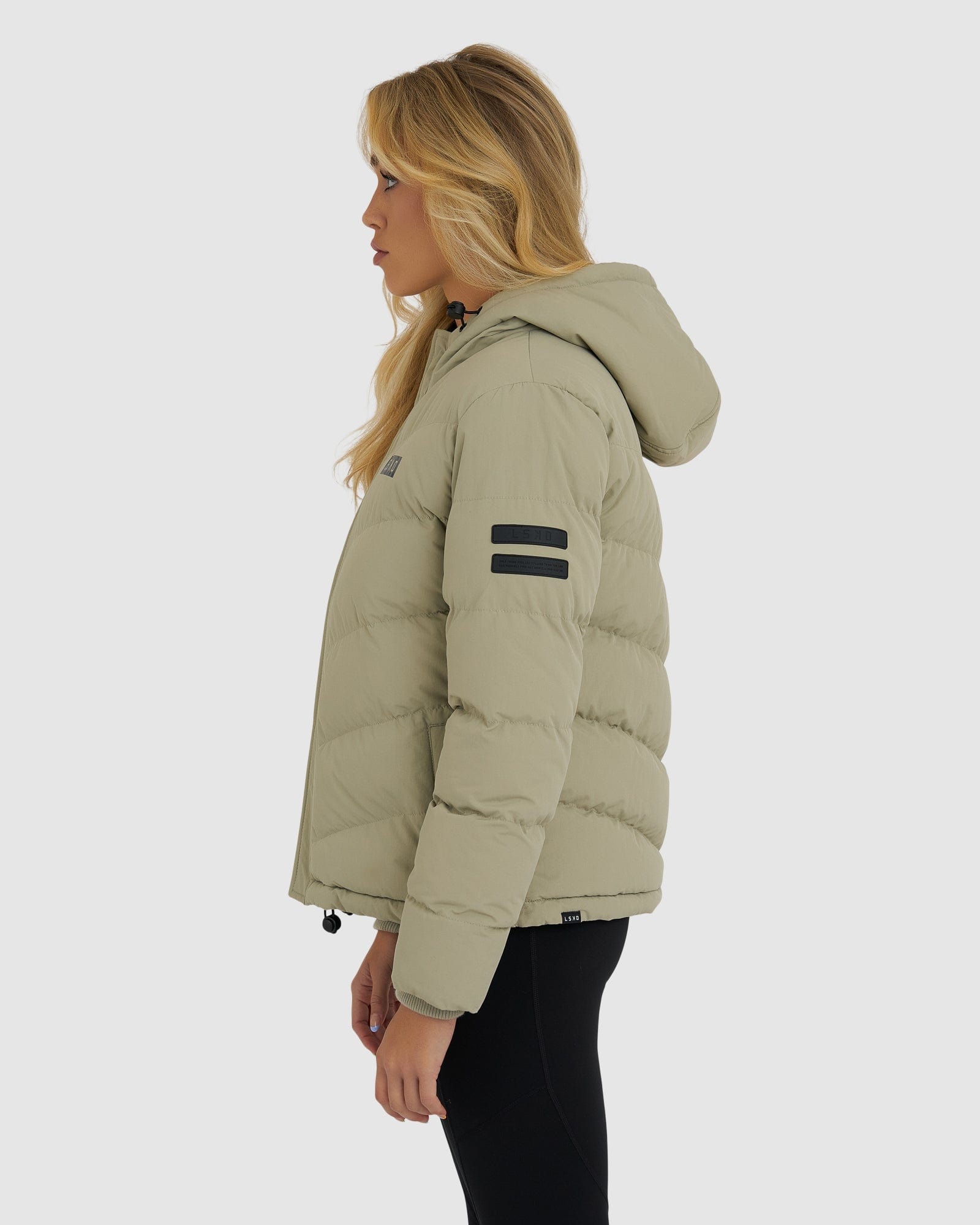 Model wearing Roasted Puffer Jacket 21  - Stone