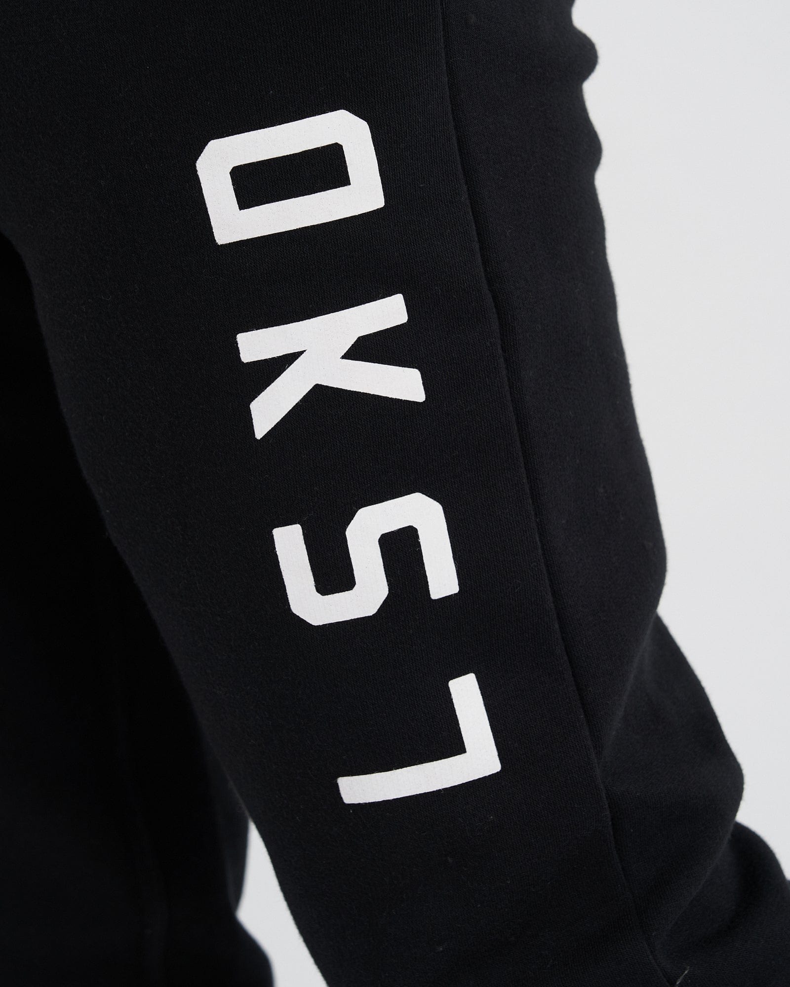 Model wearing Structure Track Pant - Black-White