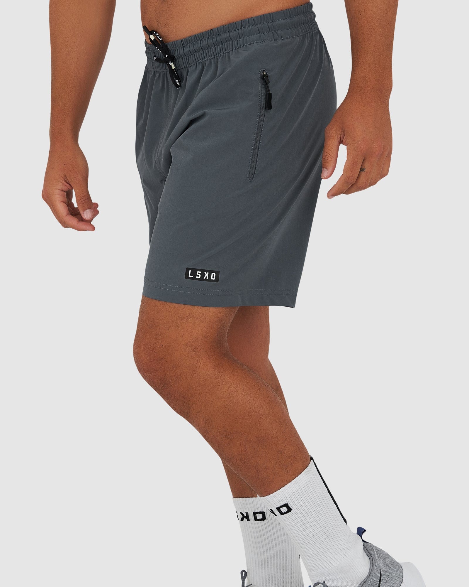 Model wearing Rep 7" Performance Short - Turbulence