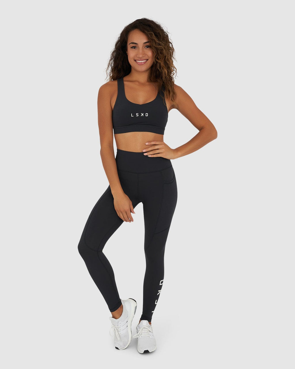 Model wearing Rep Sports Bra Small Logo - Midnight