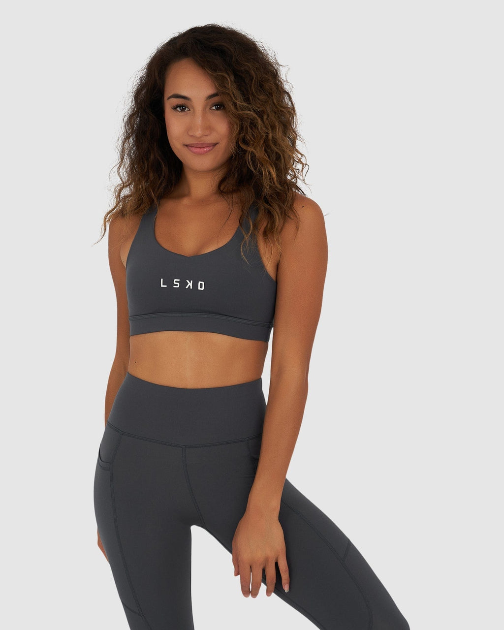 Model wearing Rep Sports Bra Small Logo - Turbulence