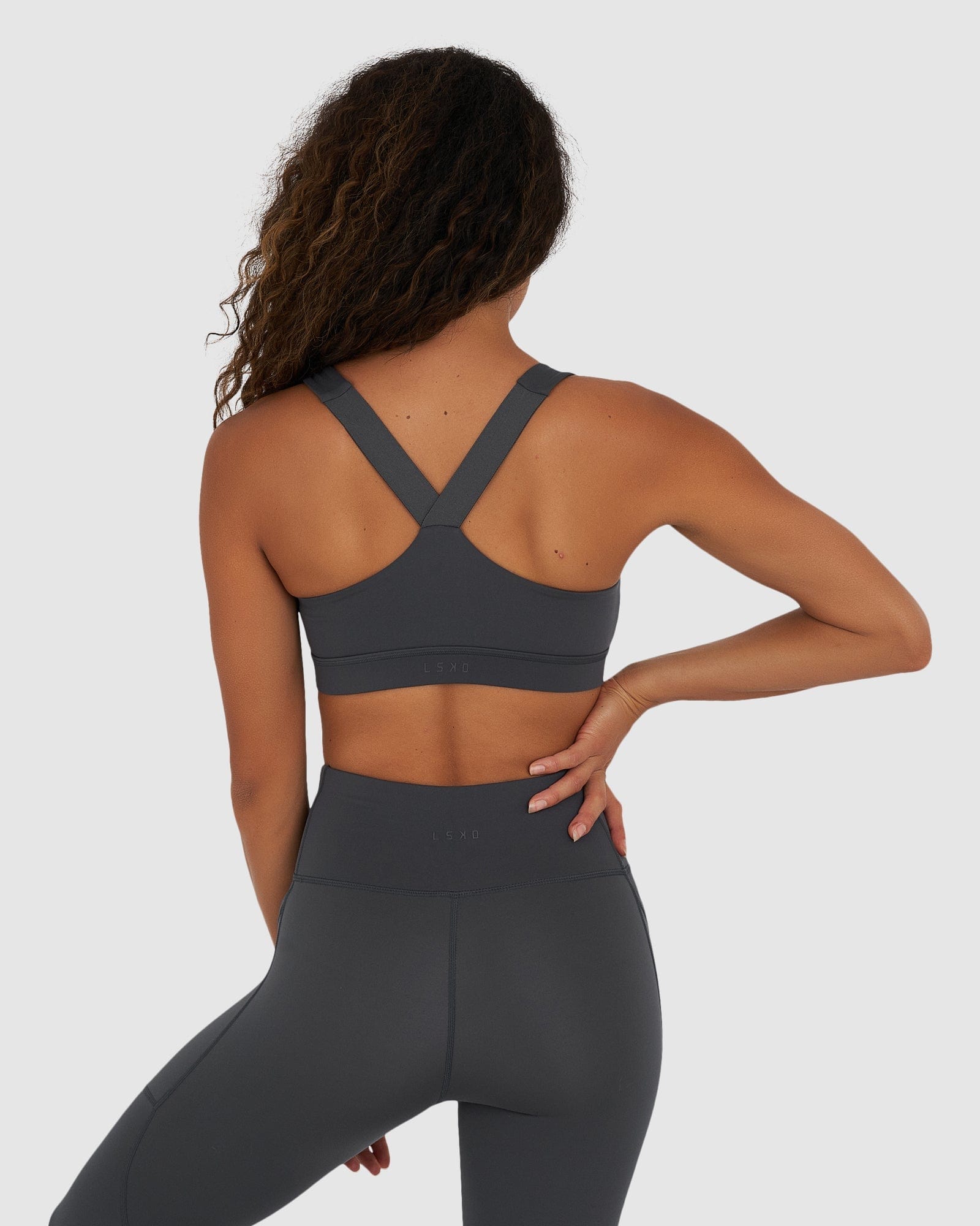 Model wearing Rep Sports Bra Small Logo - Turbulence