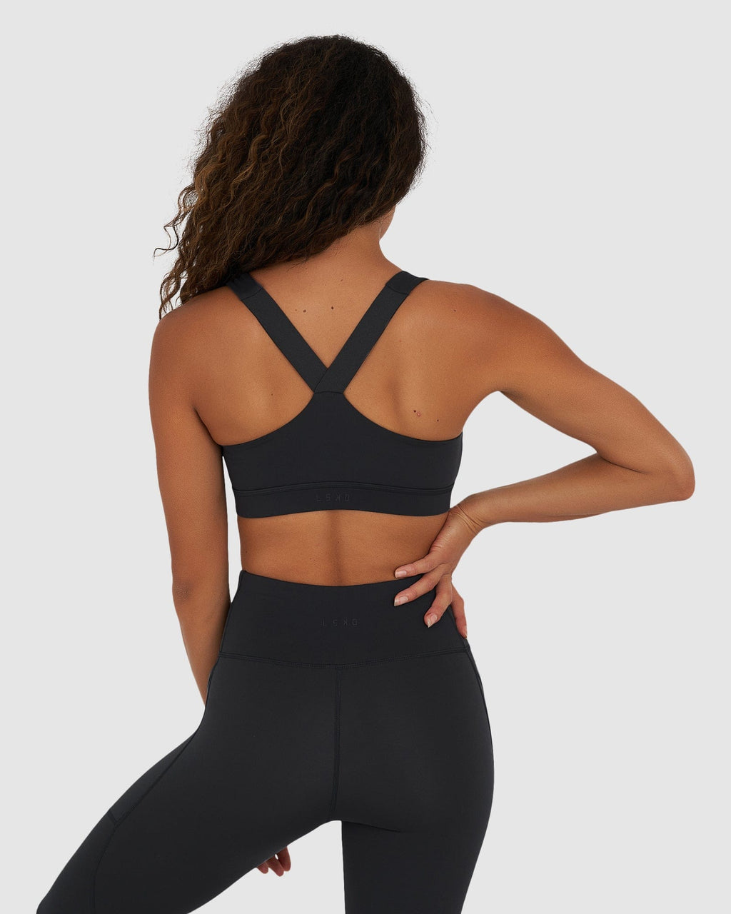 Model wearing Rep Sports Bra Small Logo - Midnight