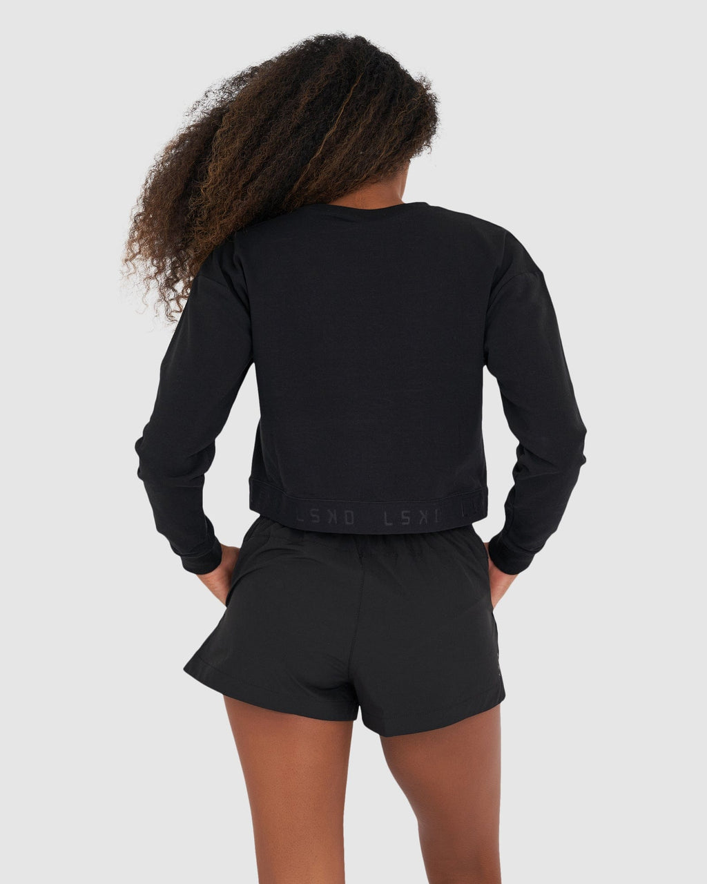 Model wearing Competition Sweater - Black