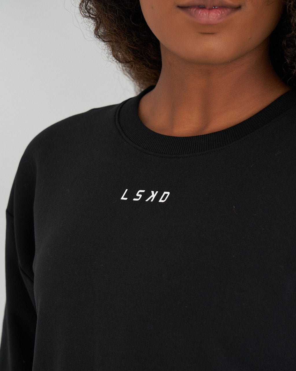 Model wearing Competition Sweater - Black