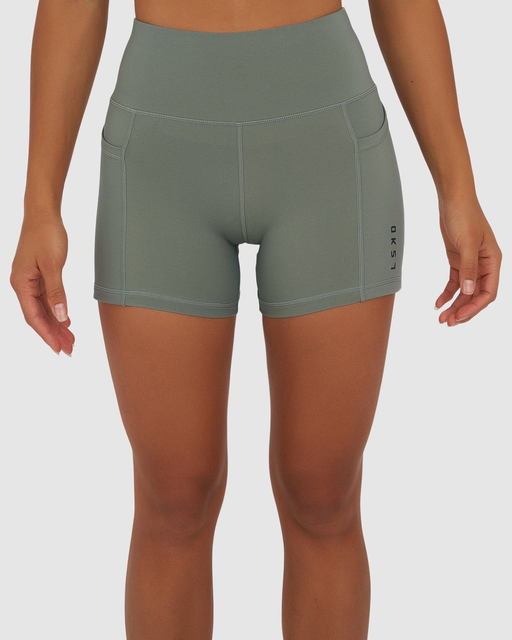 Model wearing Rep X-Short Tight Small Logo - Graphite