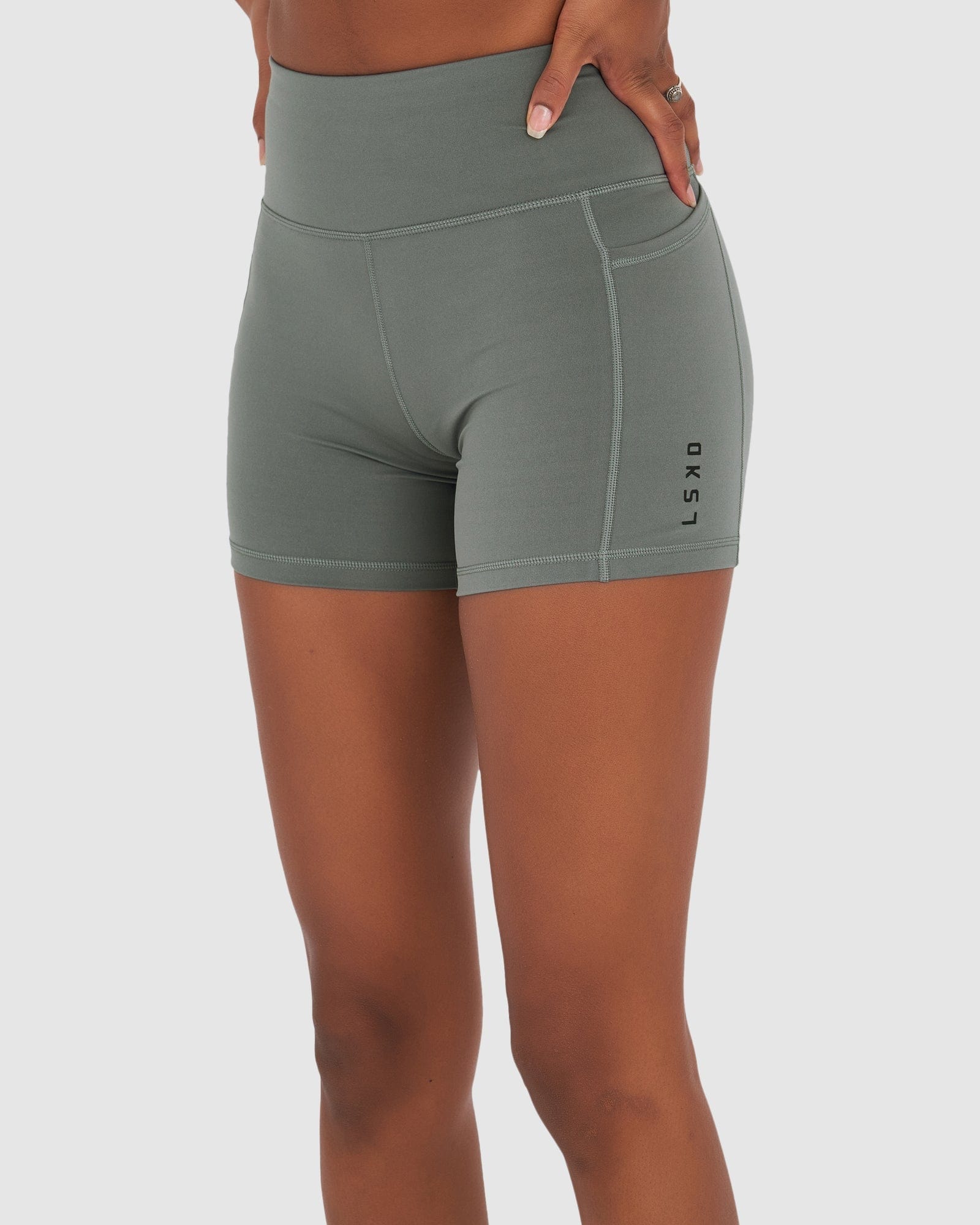 Model wearing Rep X-Short Tight Small Logo - Graphite