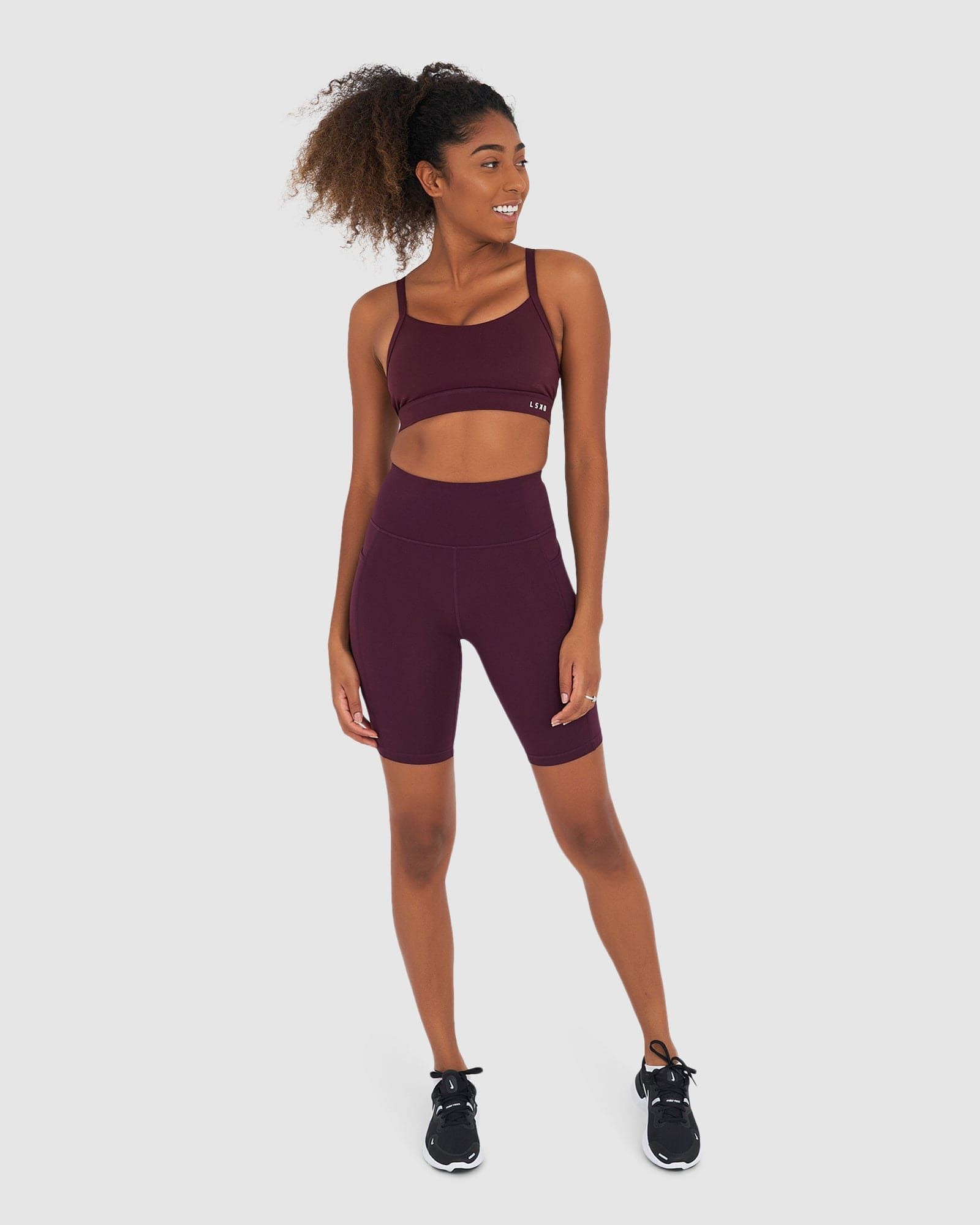 Model wearing Rep Short Tight Small Logo - Wine