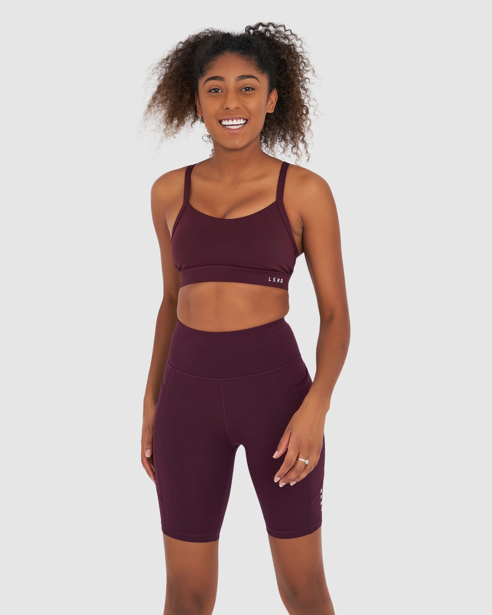 Model wearing Rep Short Tight Small Logo - Wine