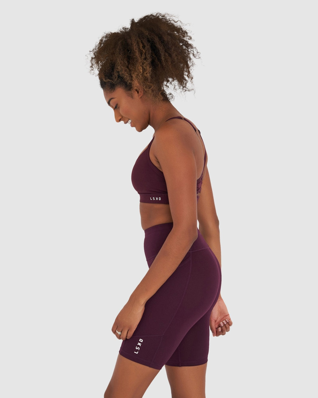 Model wearing Rep Short Tight Small Logo - Wine