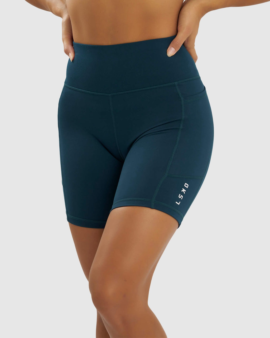 Model wearing Rep Mid Short Tight Small Logo - Deep Teal