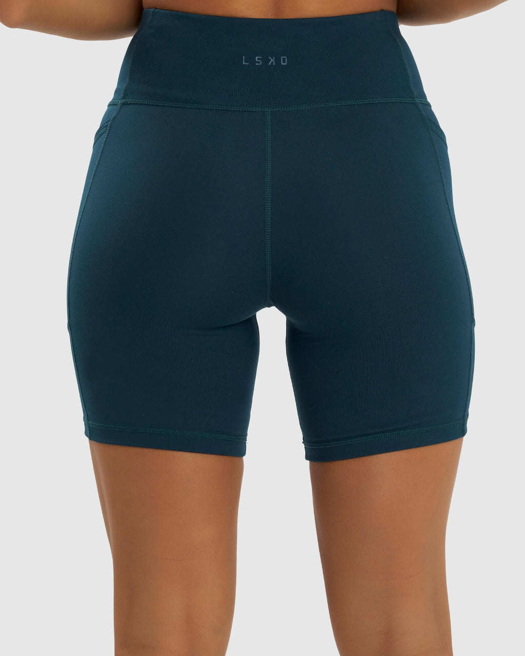 Model wearing Rep Mid Short Tight Small Logo - Deep Teal