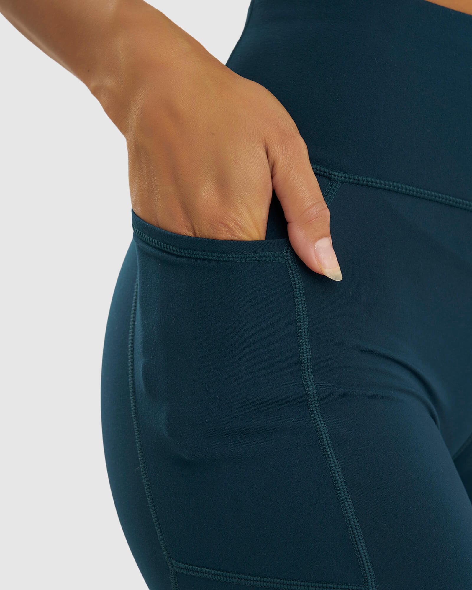 Model wearing Rep Mid Short Tight Small Logo - Deep Teal