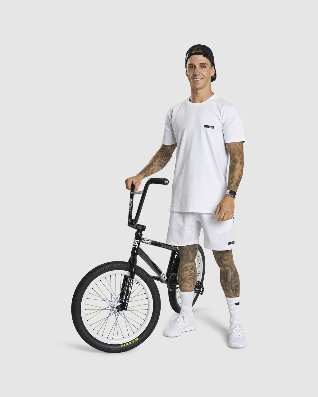 Model wearing LSKD x LM Rep 7" Performance Shorts - White