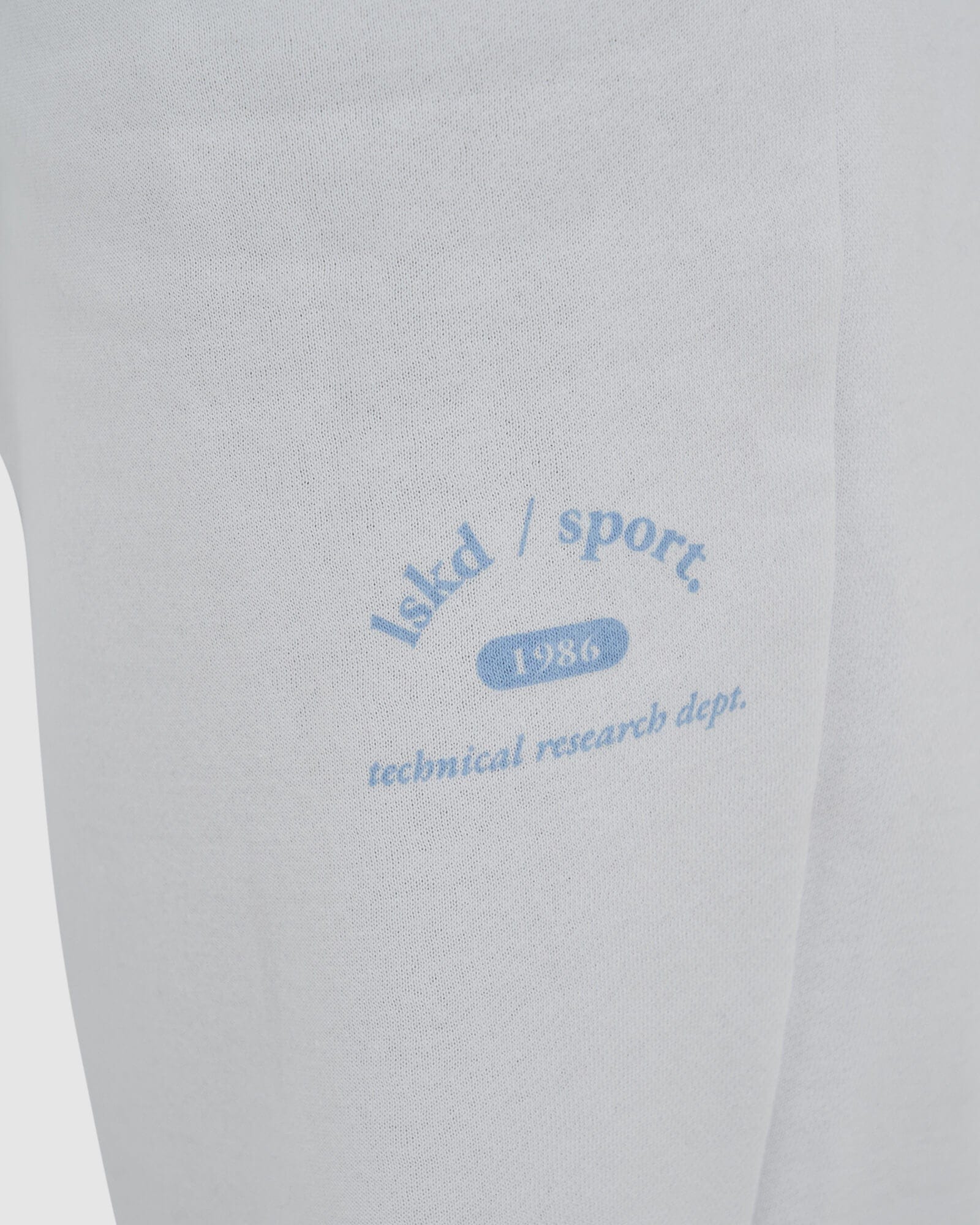 Model wearing 1986 Track Pant - White