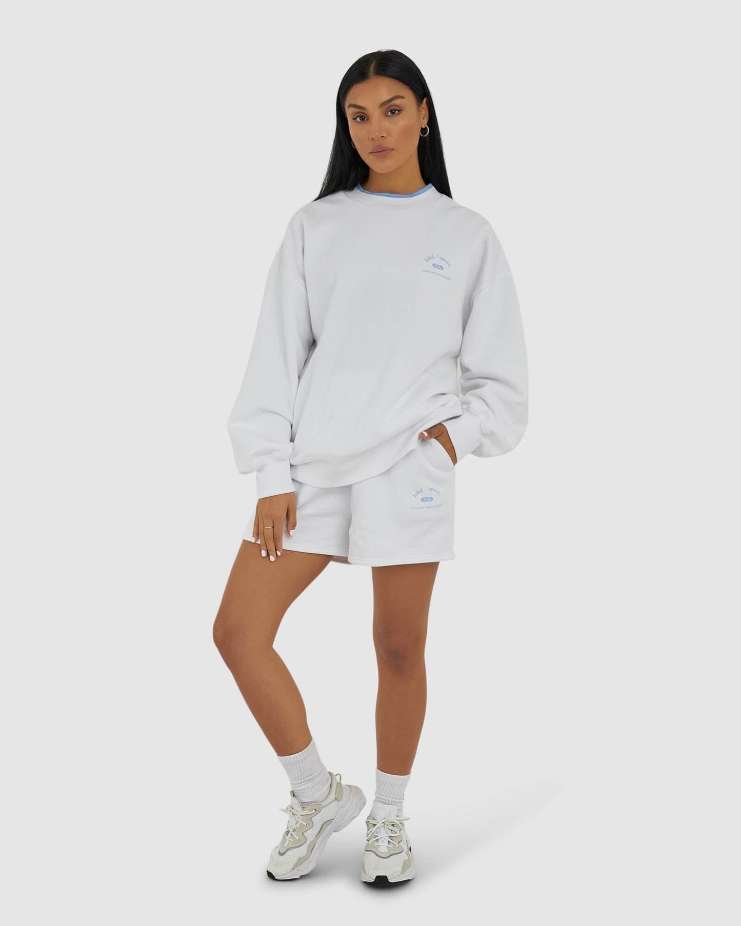 Model wearing Unisex 1986 Short - White