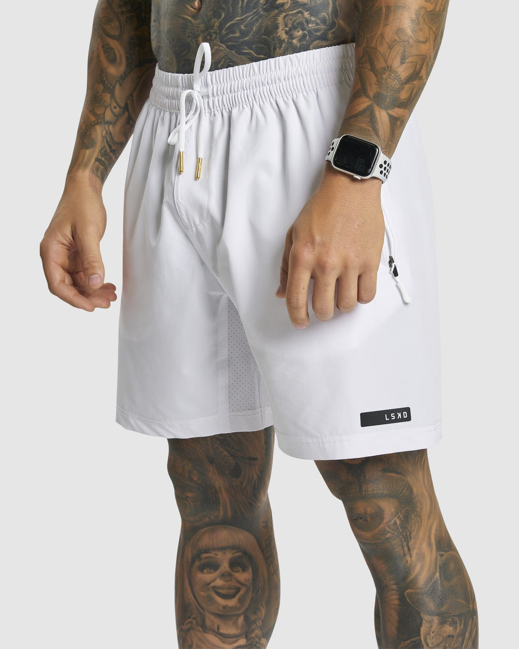 Model wearing LSKD x LM Rep 7" Performance Shorts - White