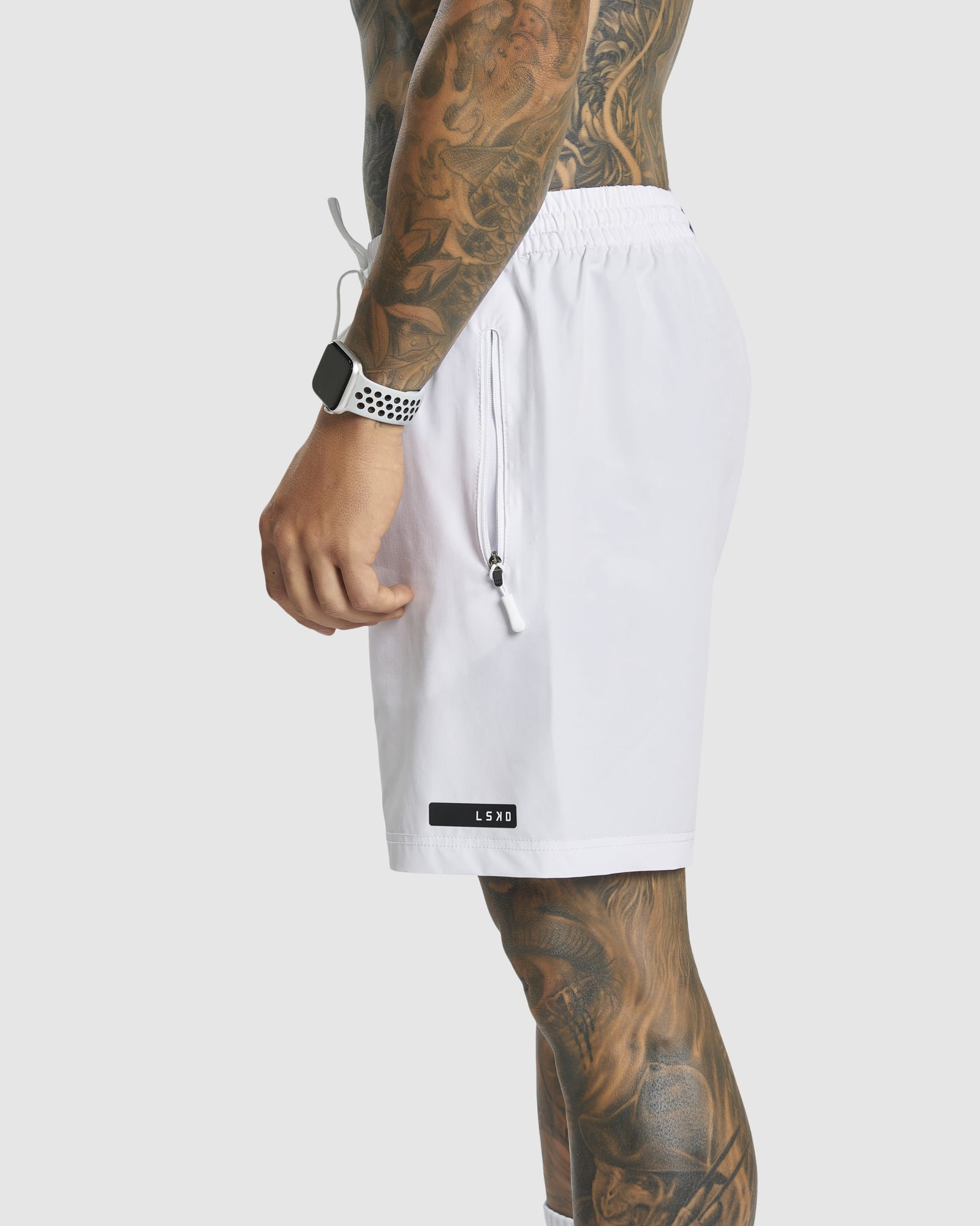 Model wearing LSKD x LM Rep 7" Performance Shorts - White