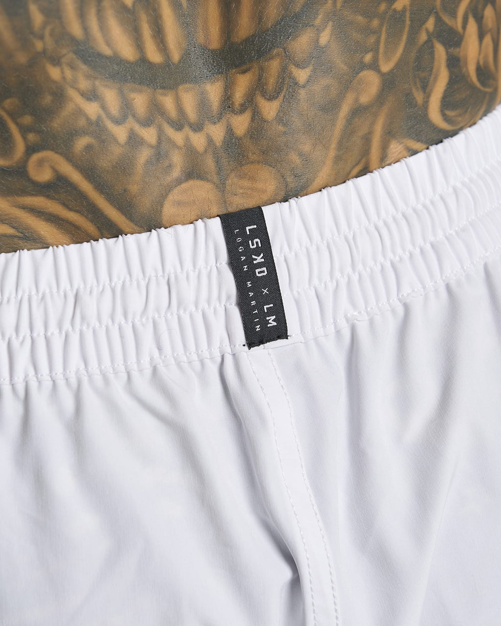 Model wearing LSKD x LM Rep 7" Performance Shorts - White