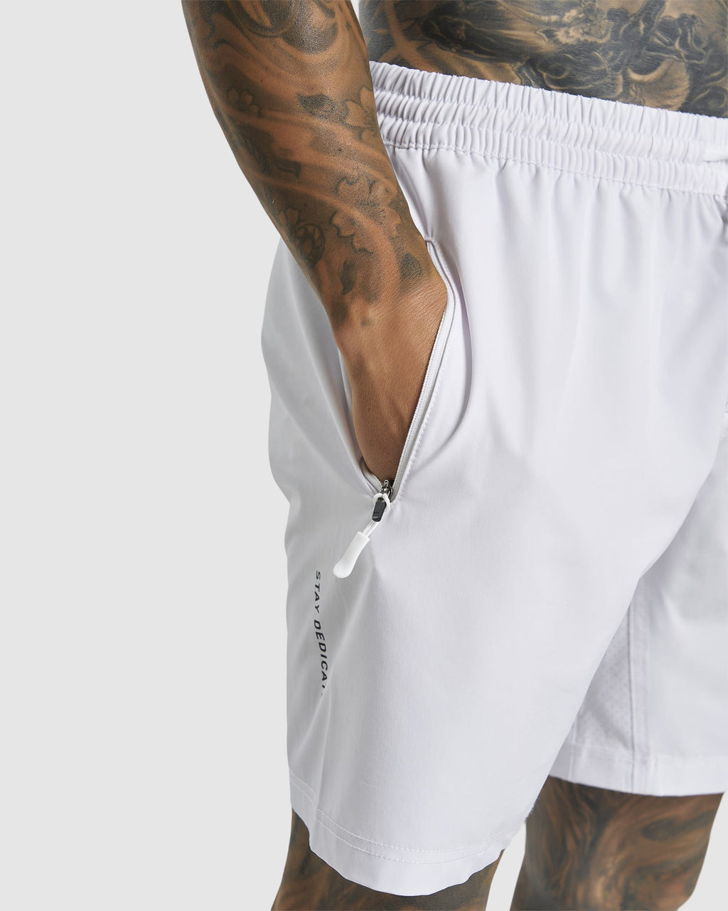 Model wearing LSKD x LM Rep 7" Performance Shorts - White