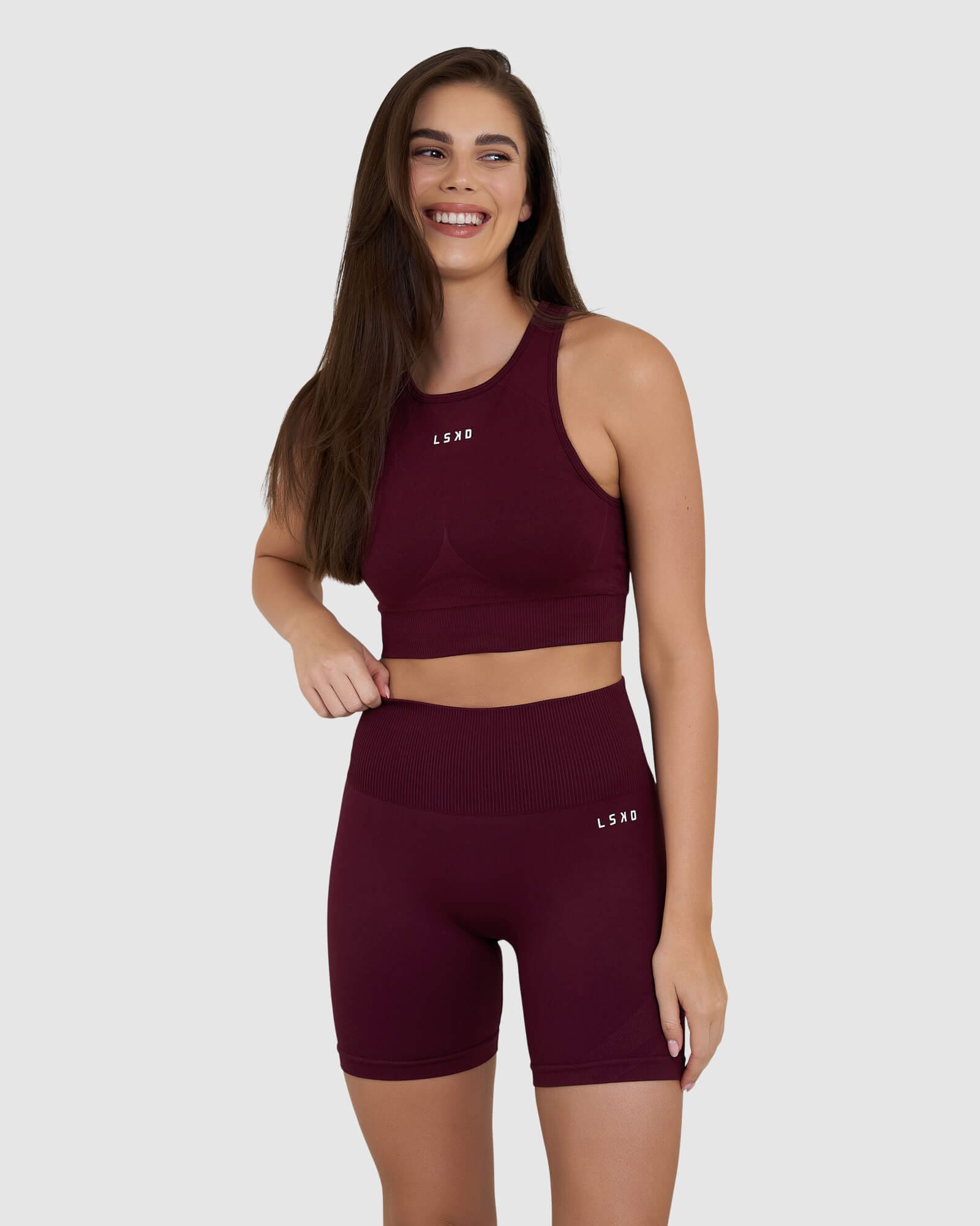 Model wearing Limitless Seamless Crop Top - Wine