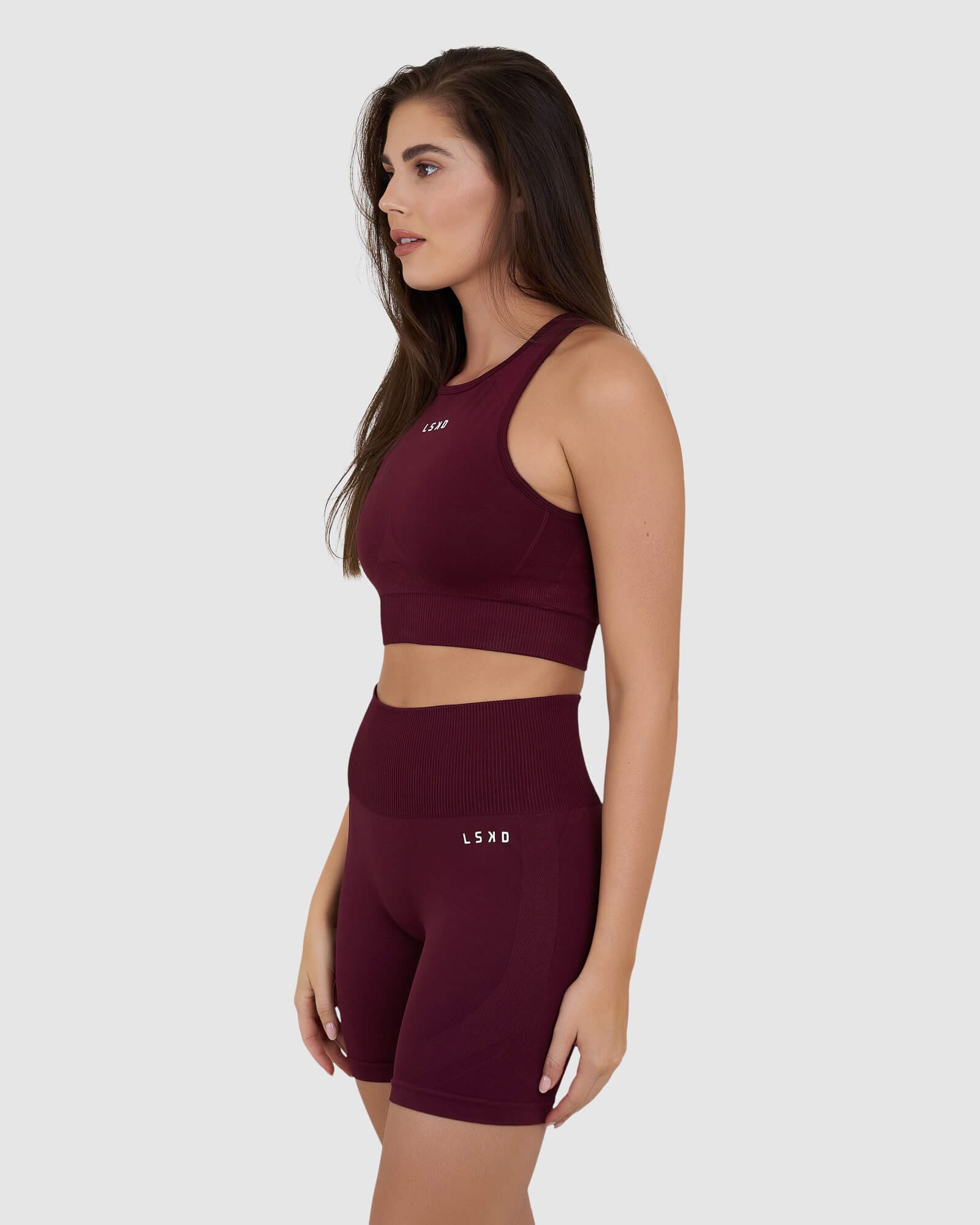Model wearing Limitless Seamless Crop Top - Wine