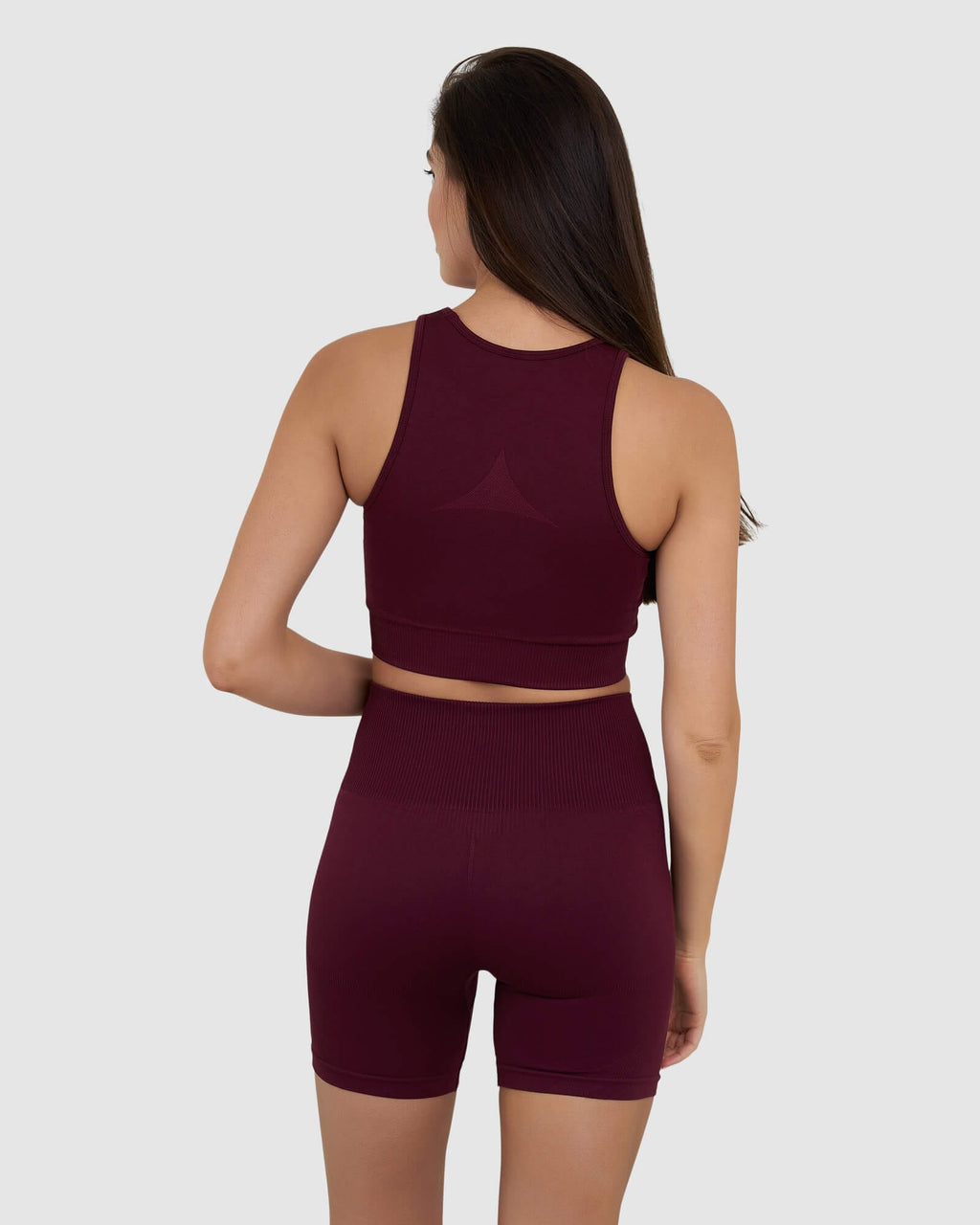 Model wearing Limitless Seamless Crop Top - Wine