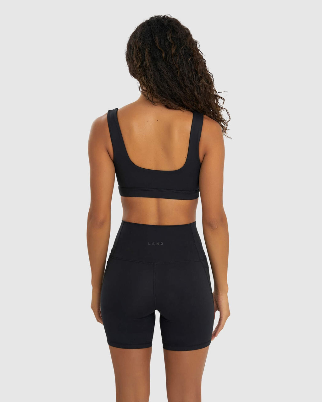 Model wearing Port Sports Bra - Black