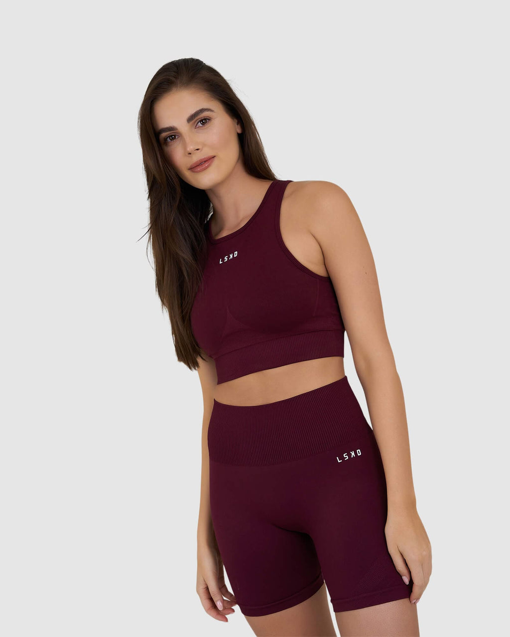 Model wearing Limitless Seamless Crop Top - Wine