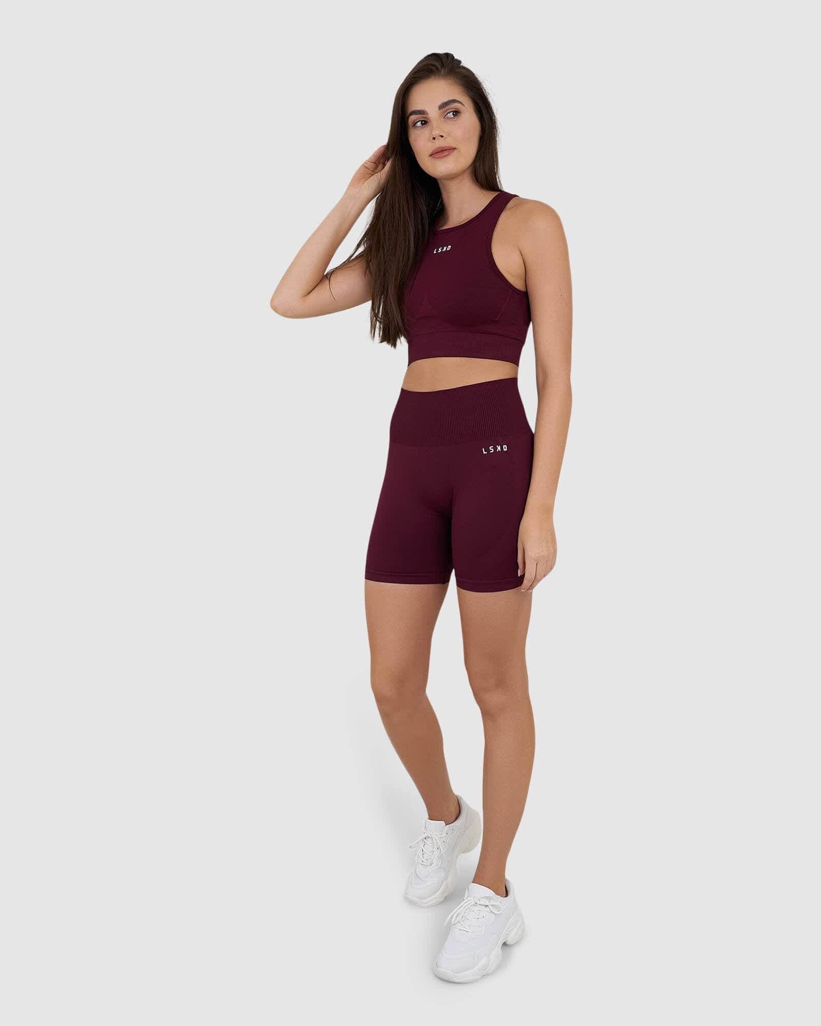 Model wearing Limitless Seamless Crop Top - Wine