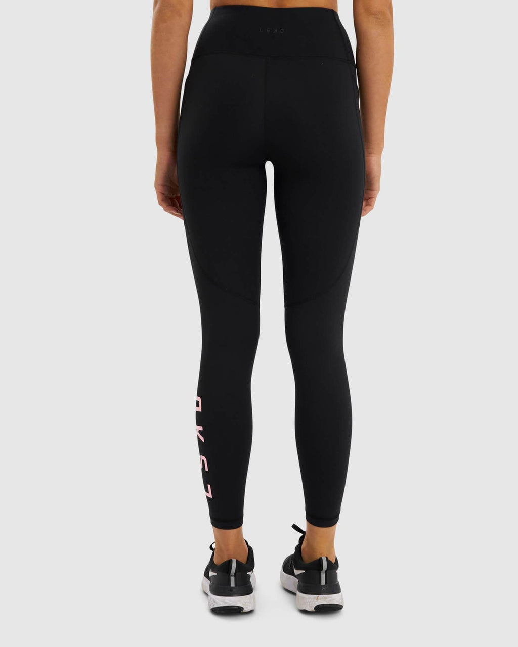 Model wearing Rep Full Length Tight - Black-Petal Pink