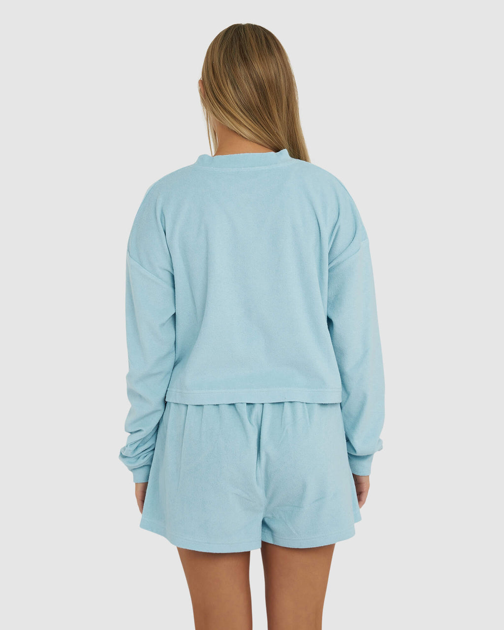 Model wearing Field LS Tee - Blue