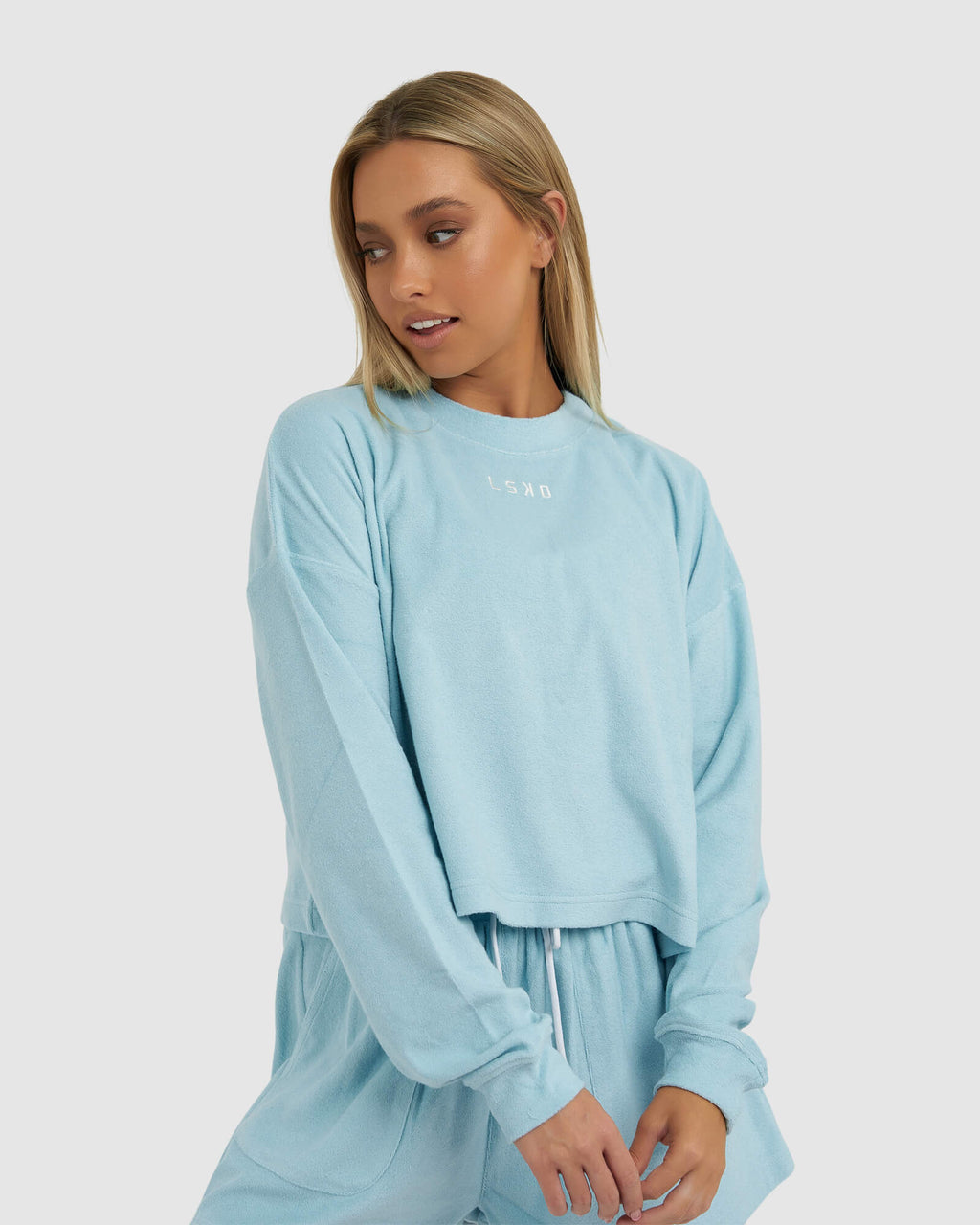 Model wearing Field LS Tee - Blue