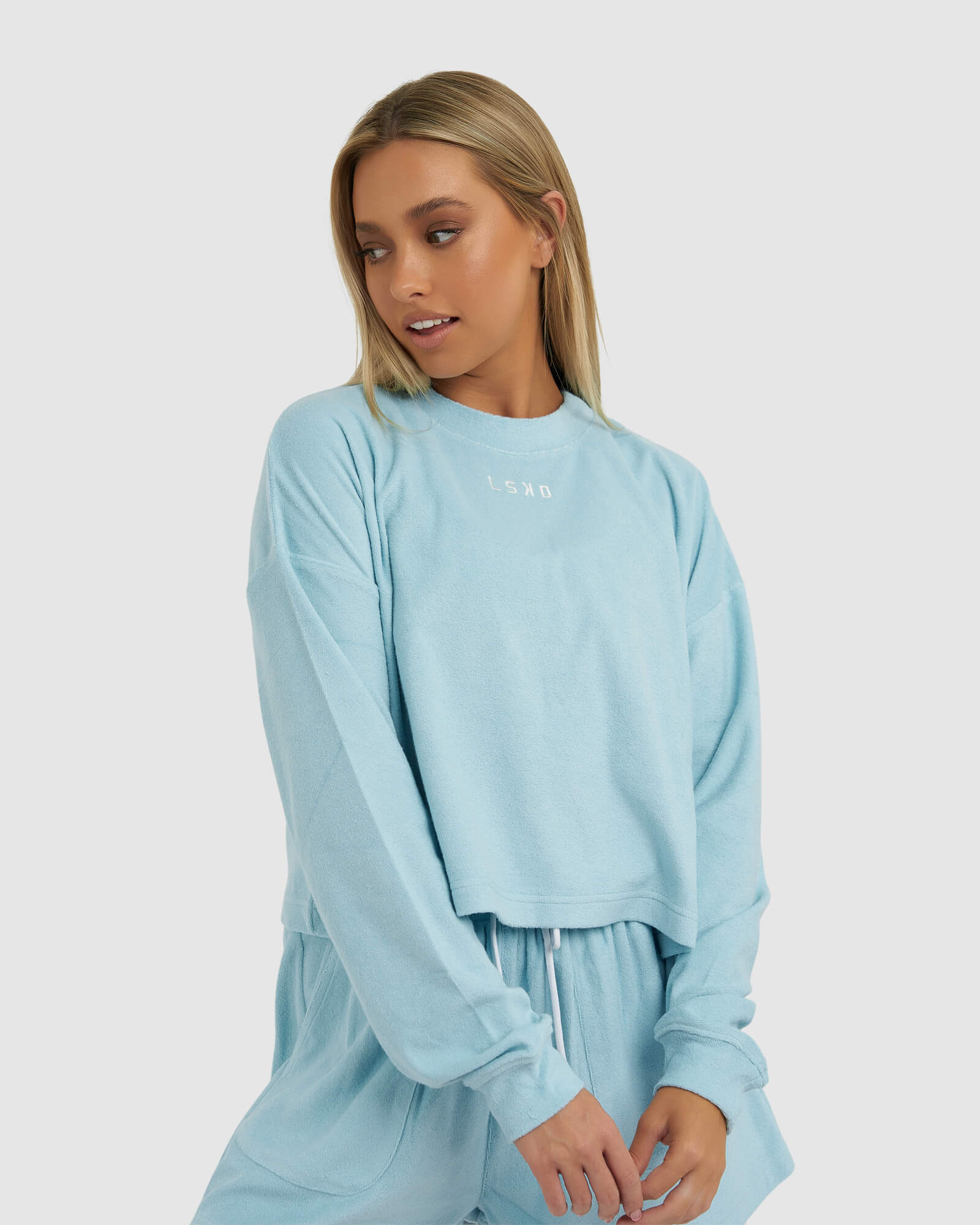 Model wearing Field LS Tee - Blue