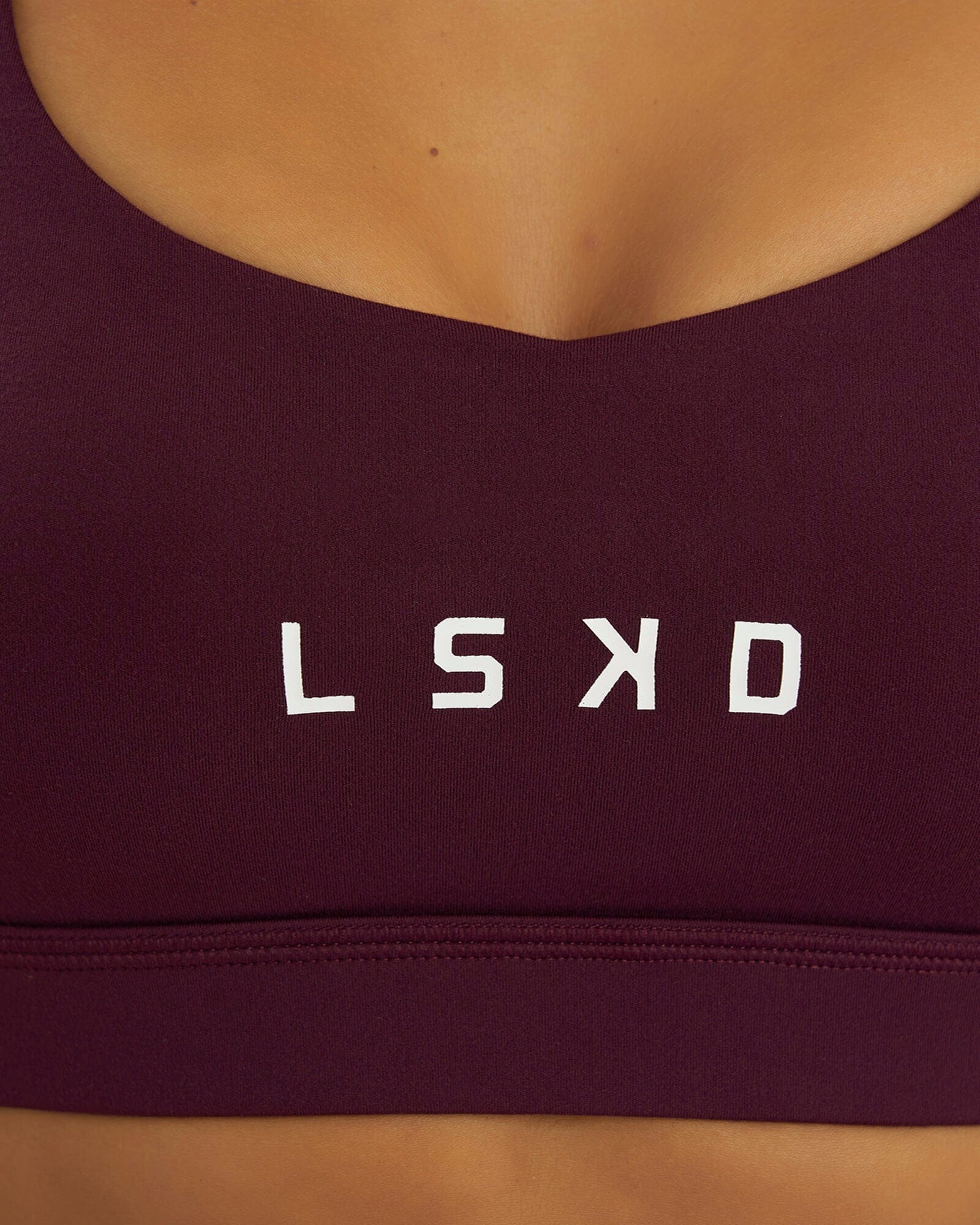 Model wearing Rep Sports Bra Small Logo - Wine