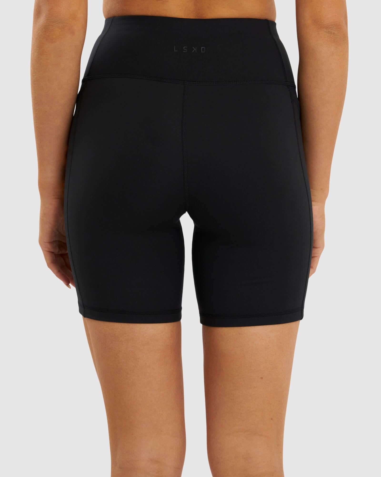 Model wearing Rep Mid Short Tight  - Black-Sherbet