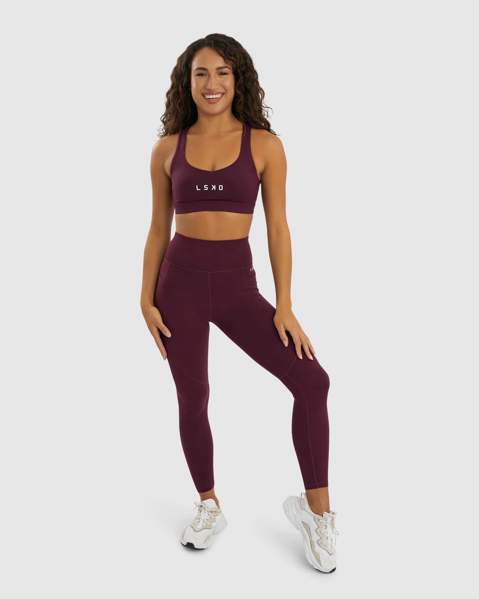 Model wearing Rep Full Length Tight Small Logo - Wine