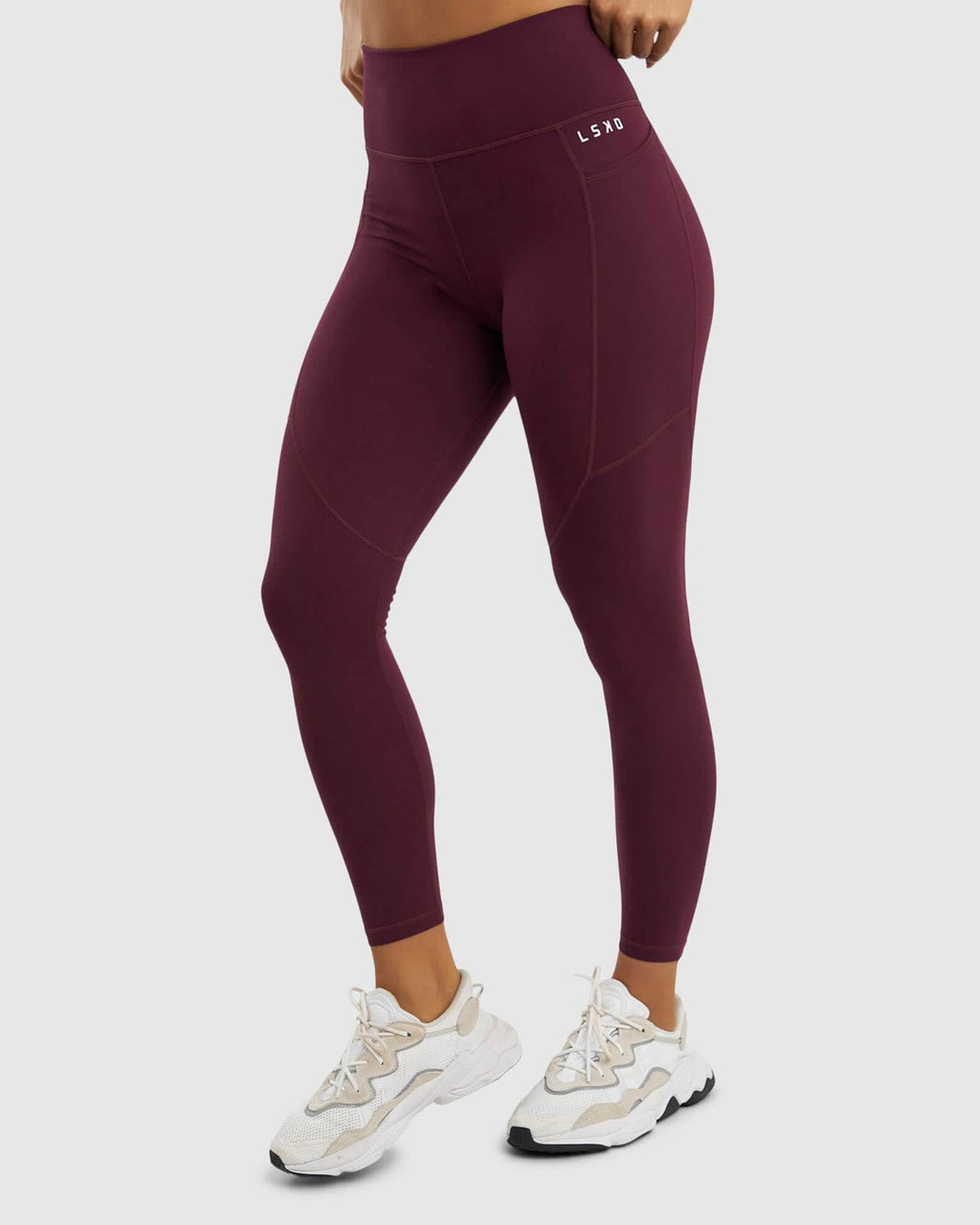 Model wearing Rep Full Length Tight Small Logo - Wine