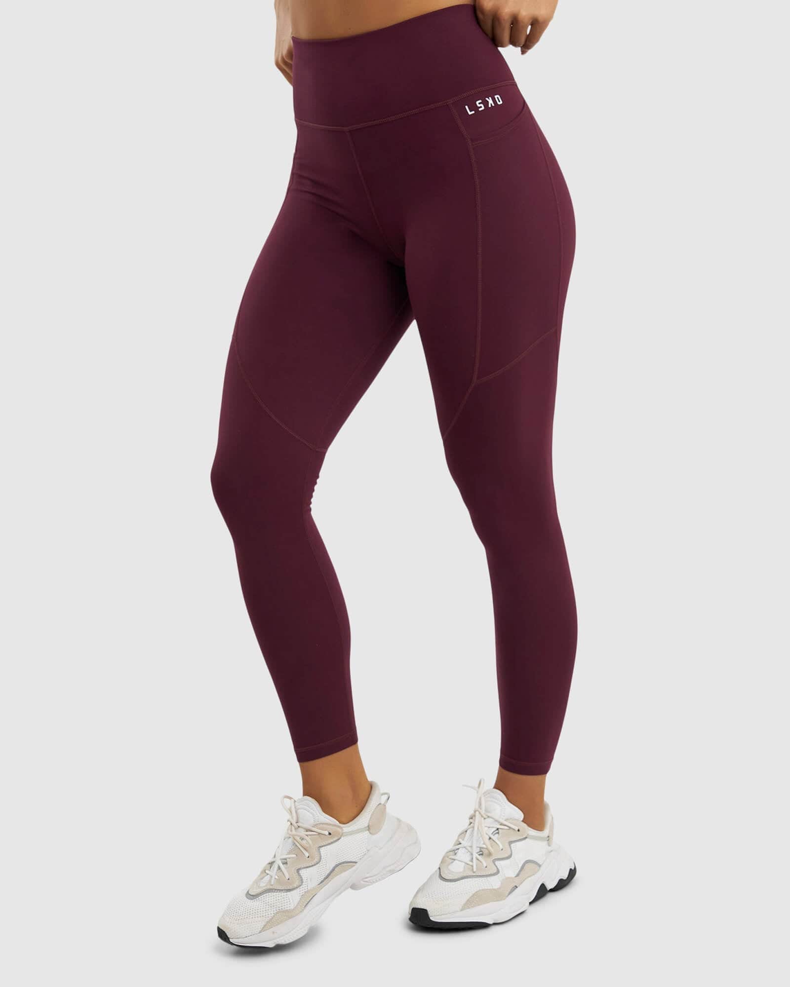 Model wearing Rep Full Length Tight Small Logo - Wine