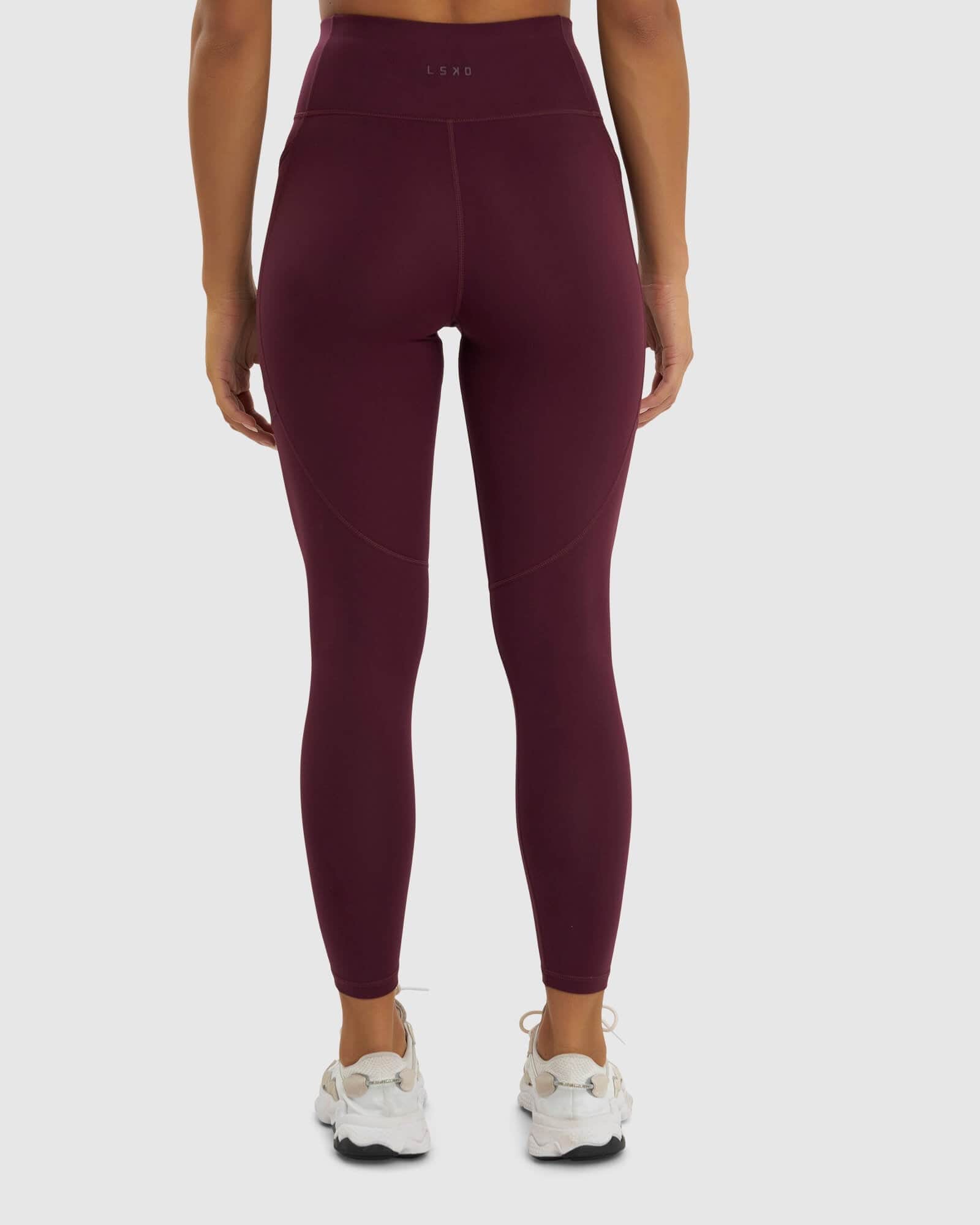 Model wearing Rep Full Length Tight Small Logo - Wine
