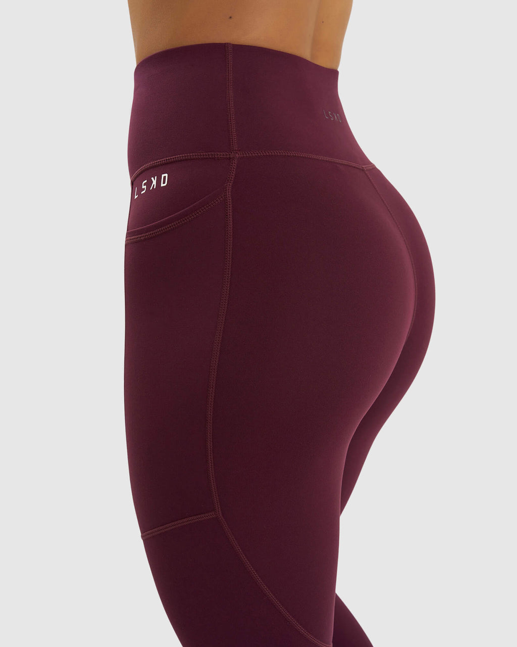 Model wearing Rep Full Length Tight Small Logo - Wine