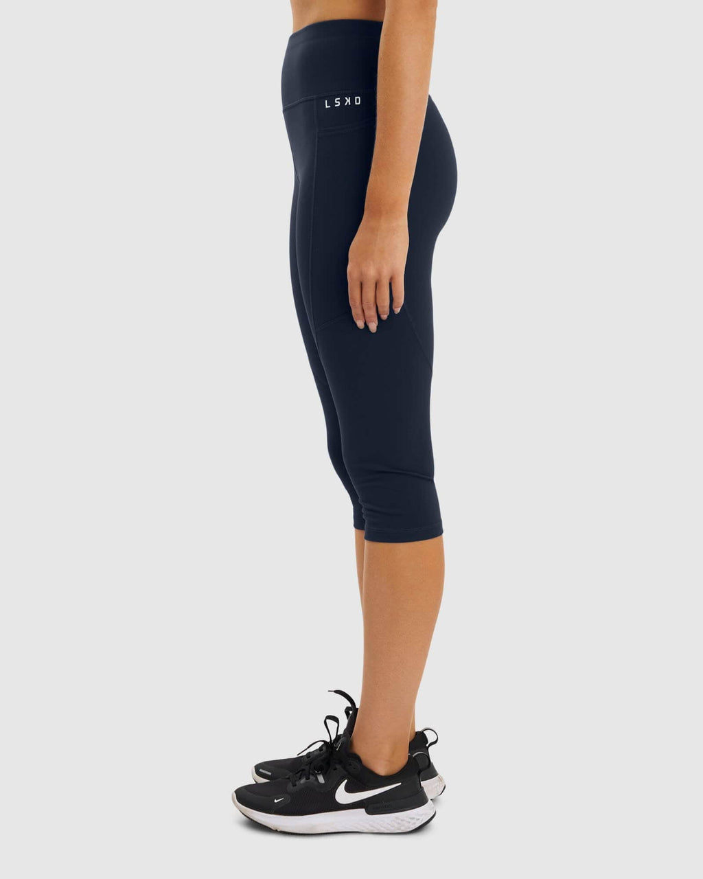 Model wearing Rep 3/4 Length Tight Small Logo - Navy
