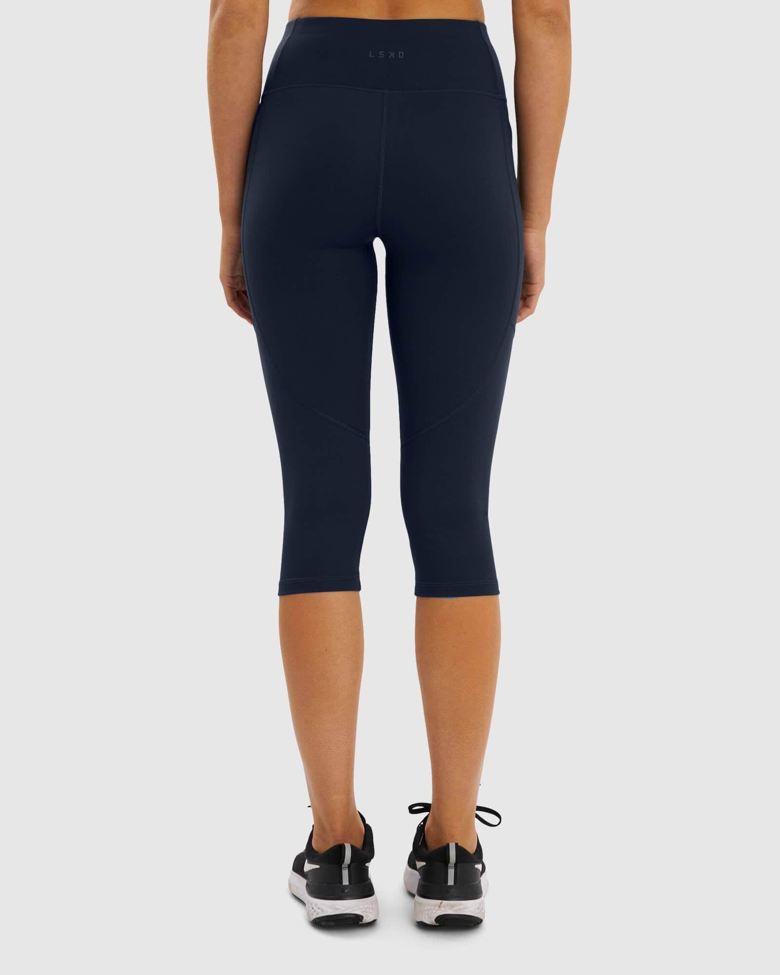 Model wearing Rep 3/4 Length Tight Small Logo - Navy