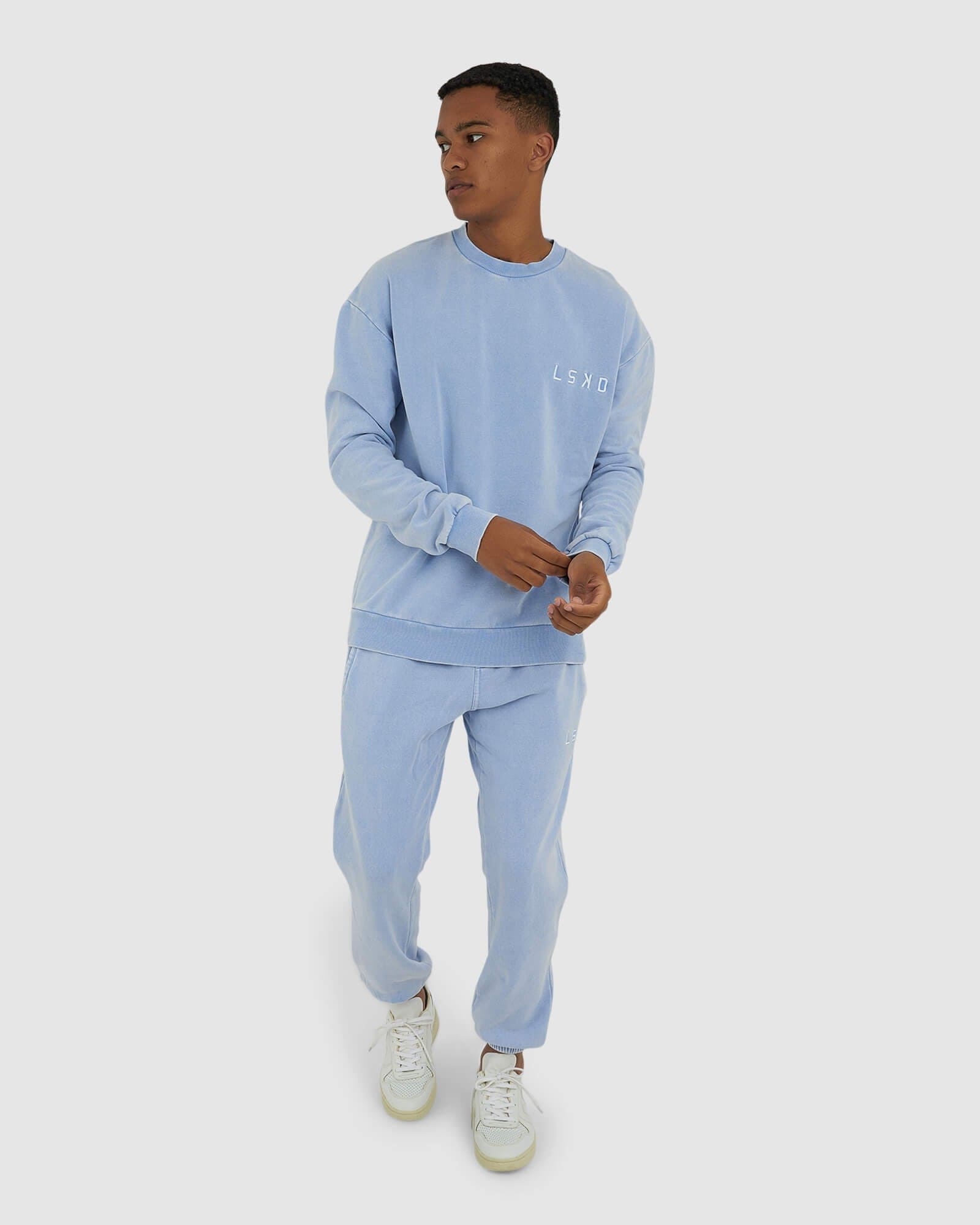 Model wearing Essential Track Pant - Pilled Pigment Blue