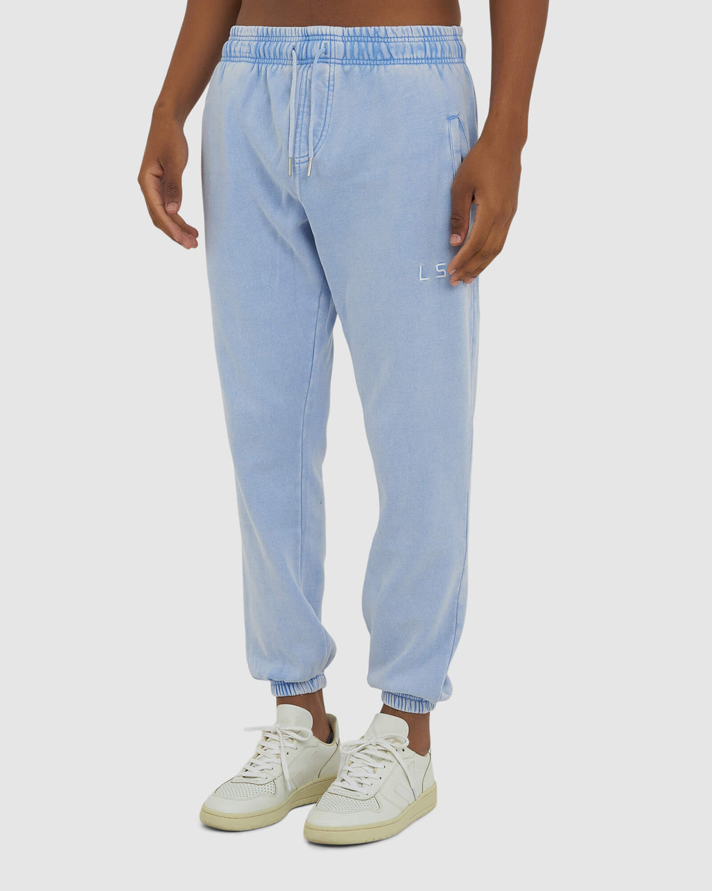 Model wearing Essential Track Pant - Pilled Pigment Blue