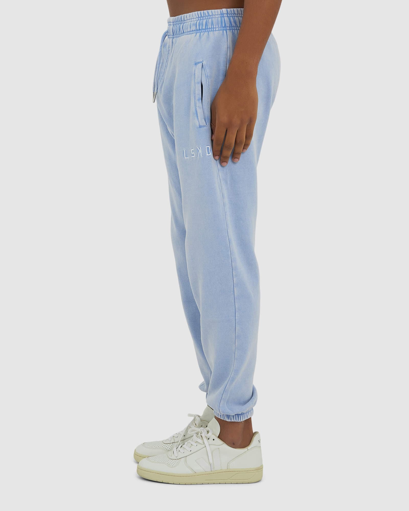 Model wearing Essential Track Pant - Pilled Pigment Blue