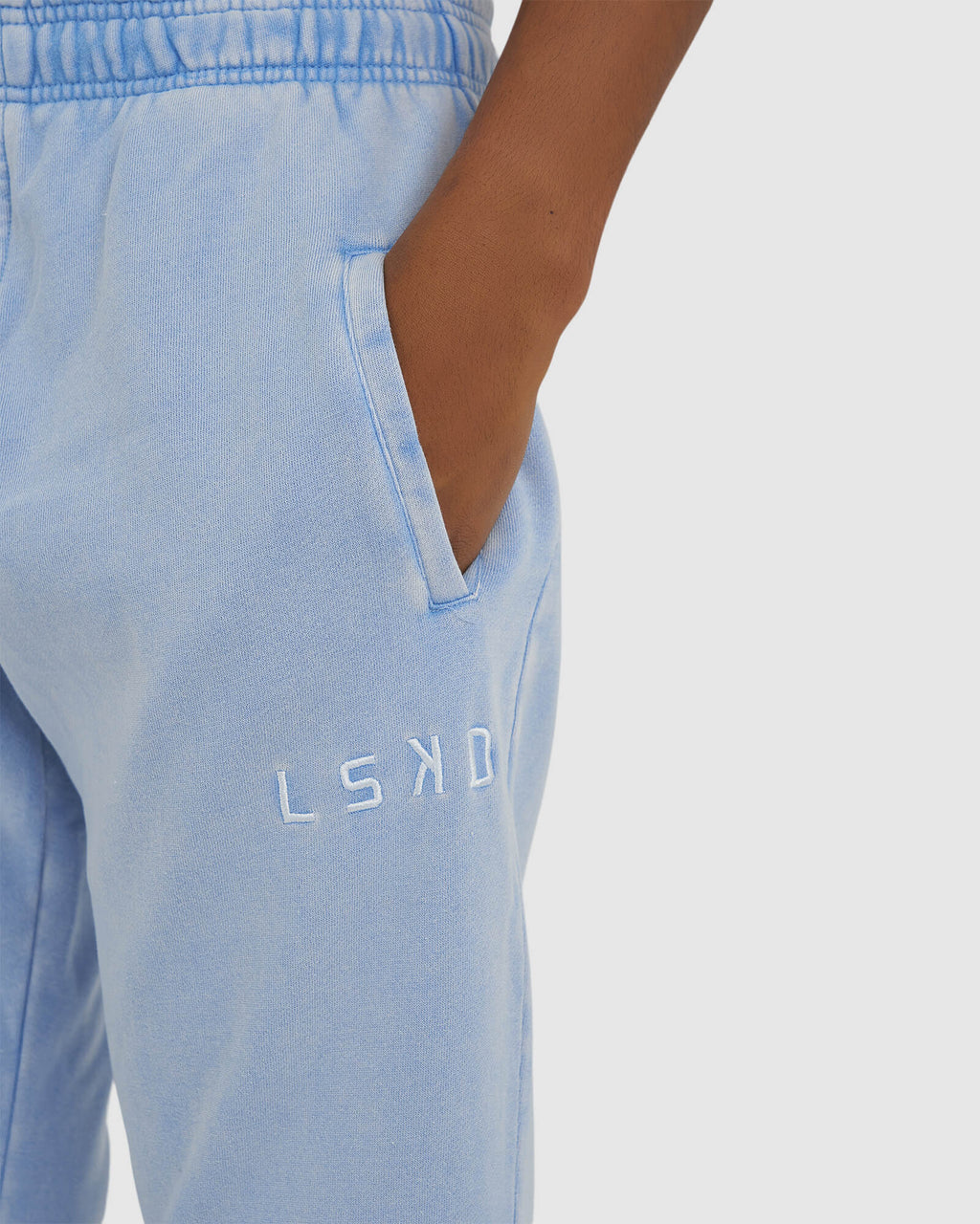 Model wearing Essential Track Pant - Pilled Pigment Blue