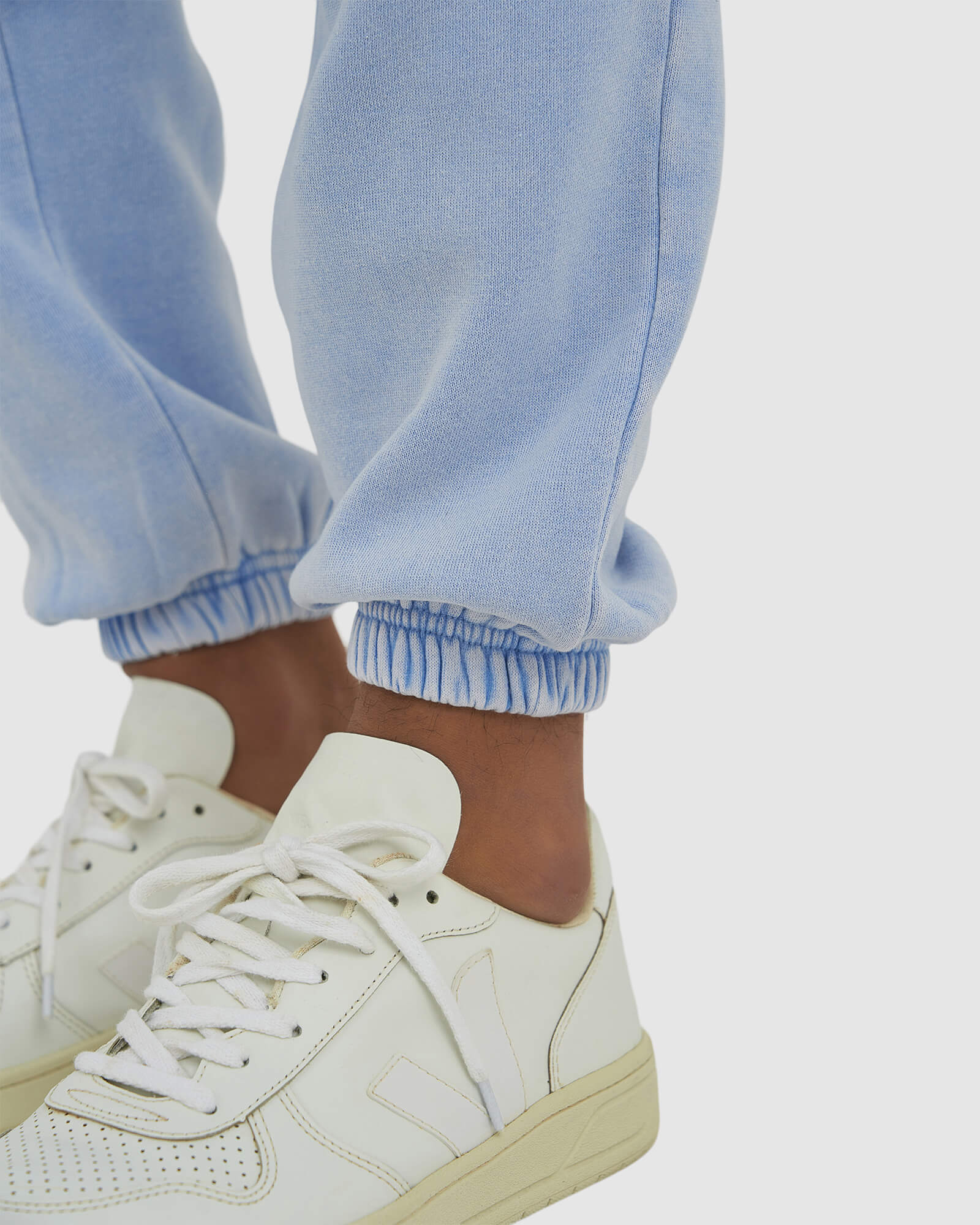 Model wearing Essential Track Pant - Pilled Pigment Blue